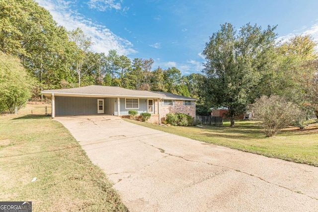 ranch-style home featuring a front yard and a carport