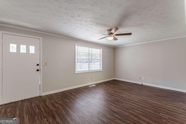 foyer with ornamental molding, a textured ceiling, dark hardwood / wood-style floors, and ceiling fan