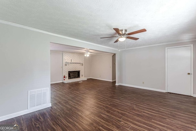 unfurnished living room with crown molding, ceiling fan, a textured ceiling, and dark hardwood / wood-style flooring