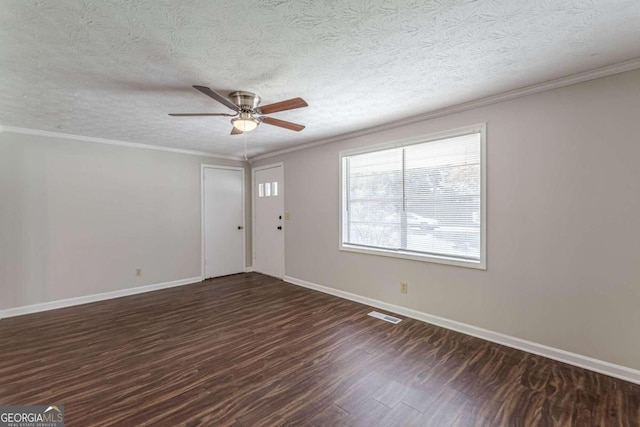 spare room with dark wood-type flooring, crown molding, a textured ceiling, and ceiling fan