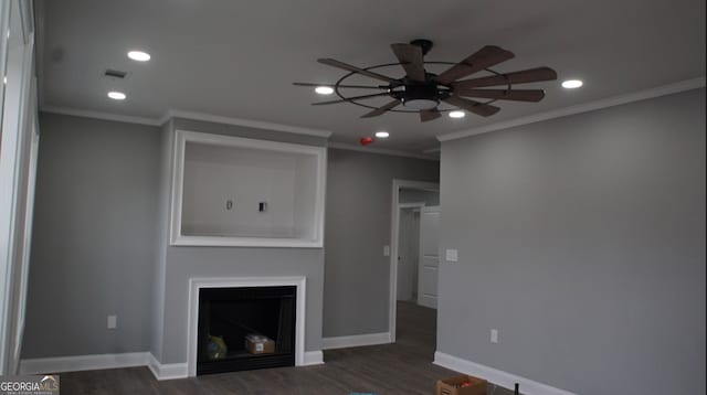 unfurnished living room with ceiling fan, ornamental molding, and dark hardwood / wood-style floors