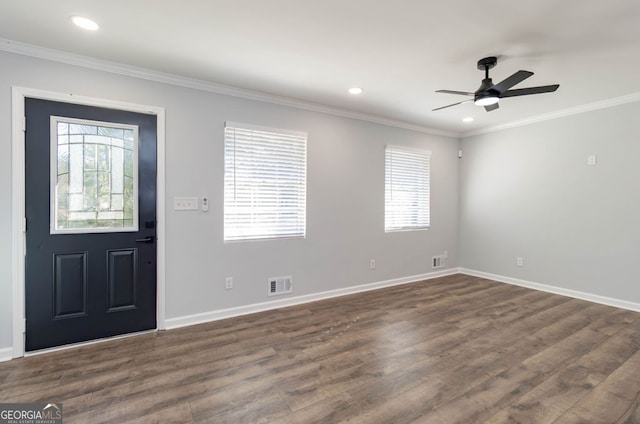 foyer entrance featuring ceiling fan, crown molding, plenty of natural light, and dark hardwood / wood-style floors