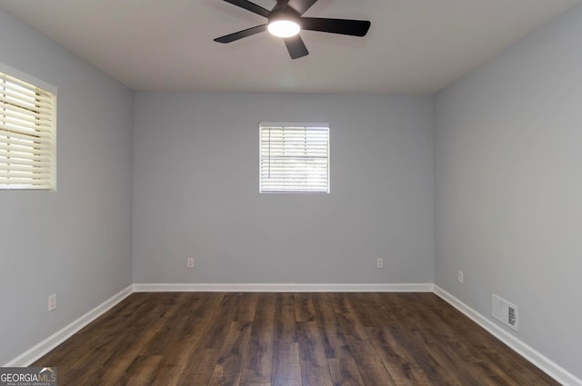 unfurnished room featuring dark hardwood / wood-style floors and ceiling fan