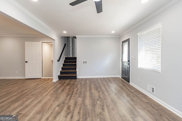 unfurnished living room with ornamental molding, hardwood / wood-style floors, and ceiling fan