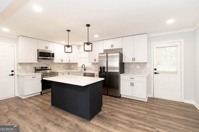 kitchen featuring a center island, white cabinets, and stainless steel appliances