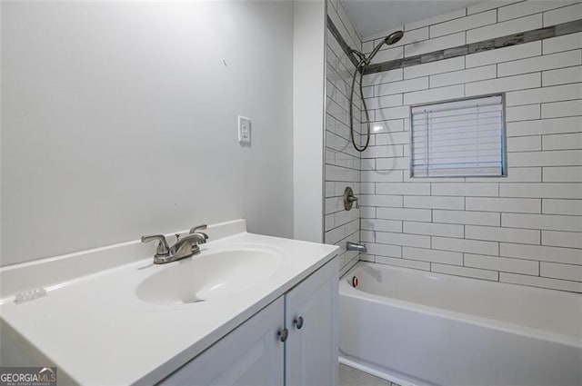 bathroom with vanity and tiled shower / bath