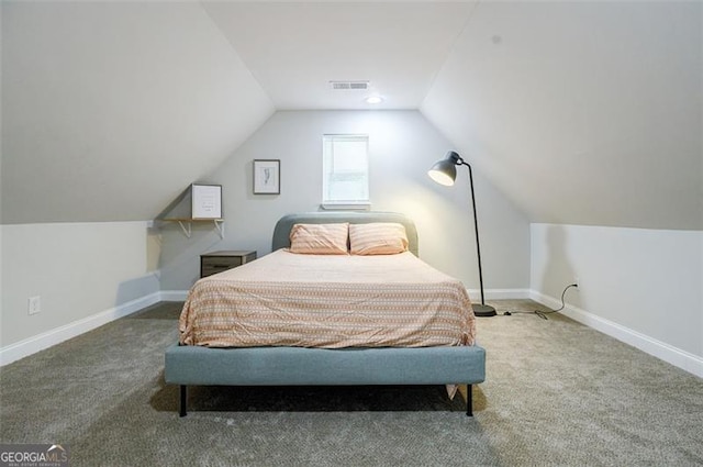 bedroom featuring carpet flooring and vaulted ceiling