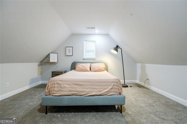 carpeted bedroom featuring lofted ceiling