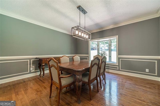 dining room with crown molding, dark wood-type flooring, and a textured ceiling