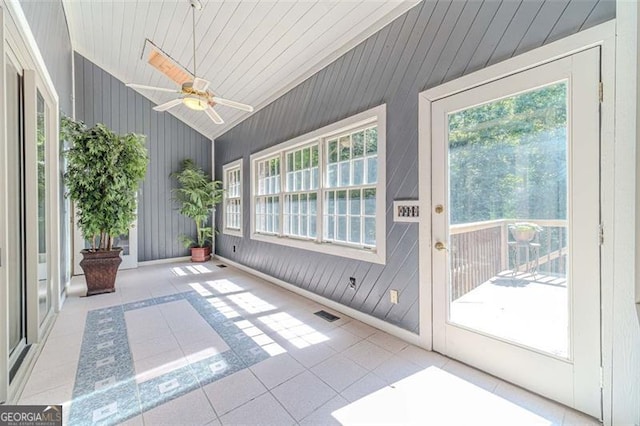 unfurnished sunroom with ceiling fan and lofted ceiling