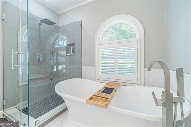 bathroom featuring plus walk in shower and ornamental molding