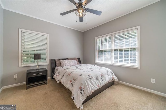 bedroom featuring carpet flooring, ceiling fan, and ornamental molding