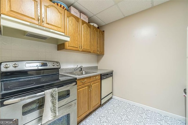 kitchen with a paneled ceiling, sink, white dishwasher, and stainless steel electric range