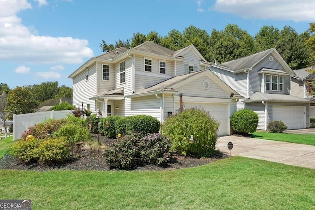 view of front facade with a front yard and a garage