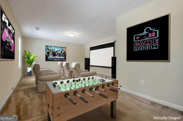 game room featuring carpet flooring and a textured ceiling