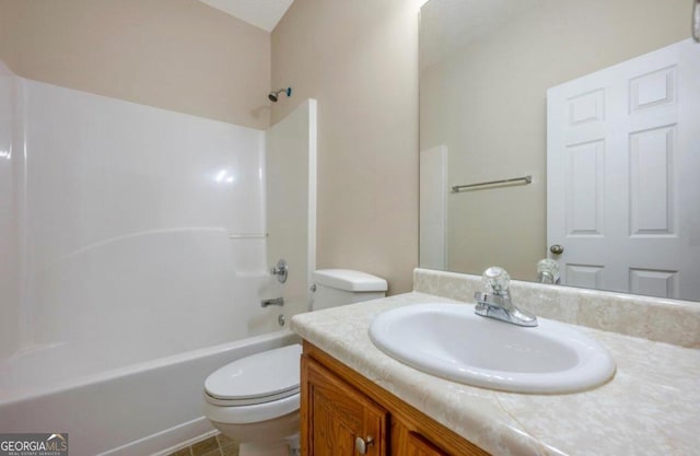 full bathroom featuring vanity, toilet, tile patterned floors, and shower / washtub combination