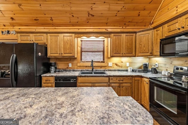 kitchen featuring lofted ceiling, light stone countertops, sink, and black appliances