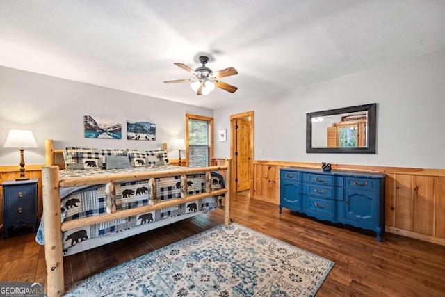 bedroom with ceiling fan and dark hardwood / wood-style flooring