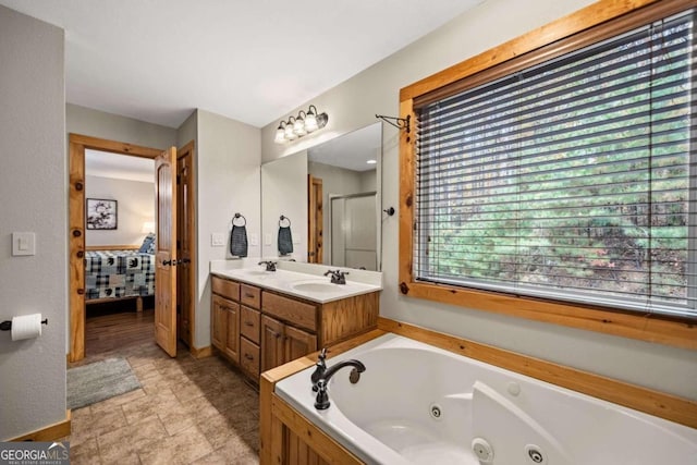 bathroom featuring vanity and shower with separate bathtub