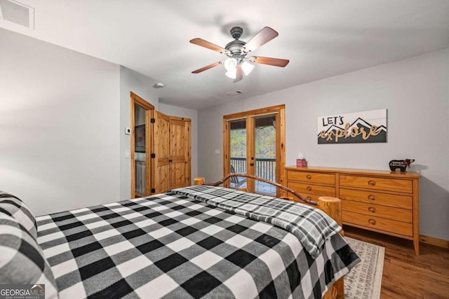 bedroom with dark hardwood / wood-style flooring, access to outside, french doors, and ceiling fan