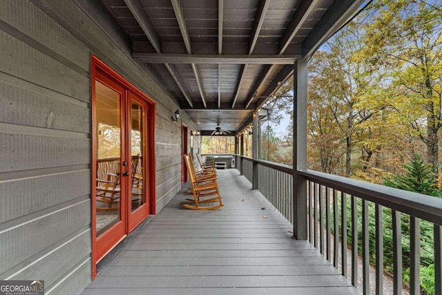 deck with french doors and ceiling fan