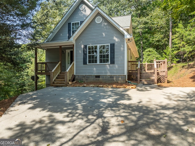 front facade with a wooden deck