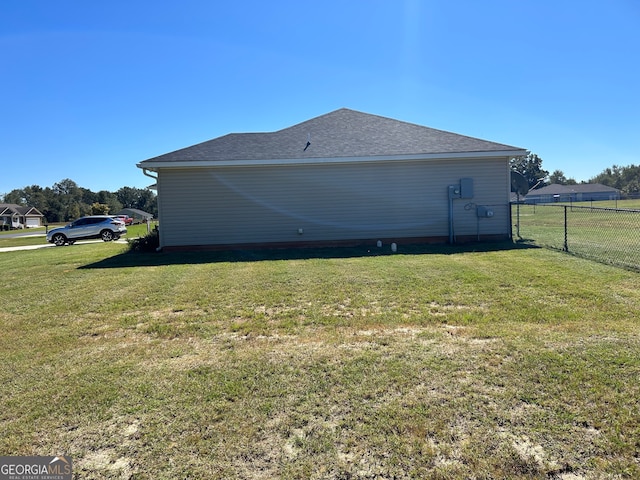 view of home's exterior featuring a yard