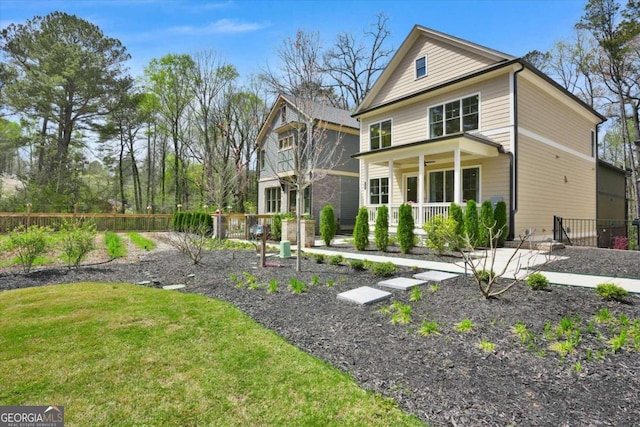 view of front of home featuring a front lawn and a porch