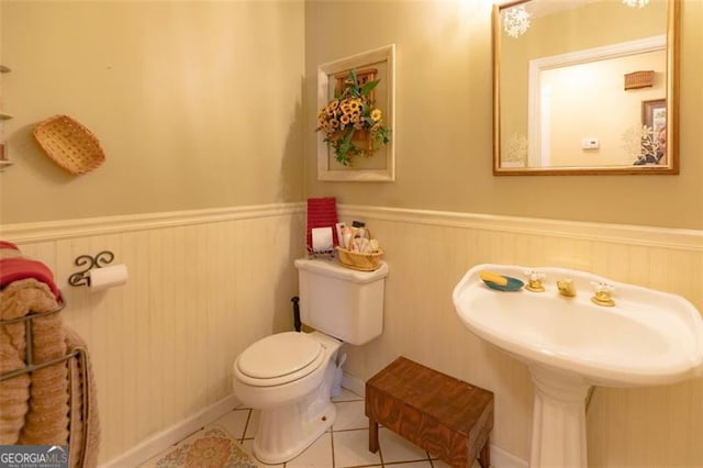 bathroom featuring tile patterned floors and toilet