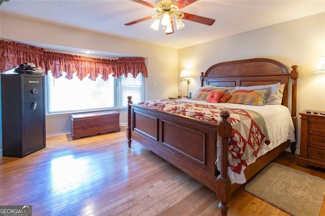 bedroom featuring ceiling fan and light hardwood / wood-style flooring