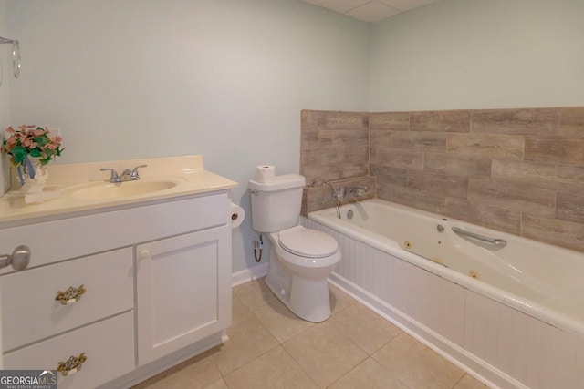 bathroom featuring a relaxing tiled tub, tile patterned flooring, toilet, and vanity