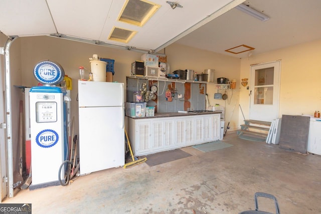 garage with white refrigerator