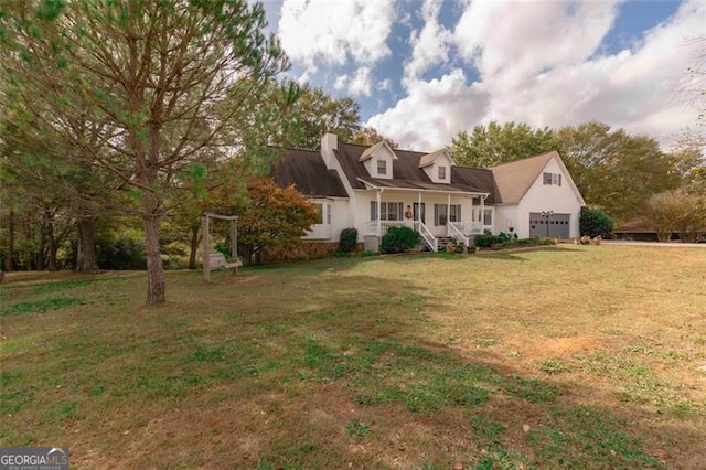 exterior space featuring a lawn and covered porch