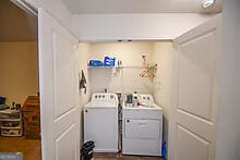 laundry area with washing machine and dryer