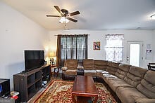 living room with ceiling fan