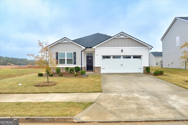 view of front of property with a front lawn and a garage