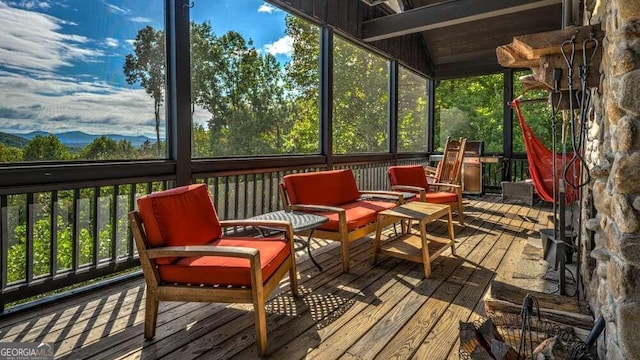 sunroom with vaulted ceiling with beams