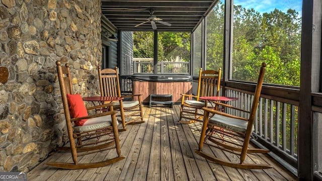 sunroom / solarium featuring ceiling fan