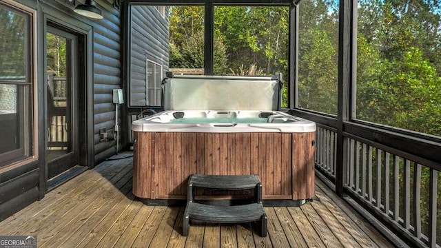 sunroom / solarium featuring a jacuzzi