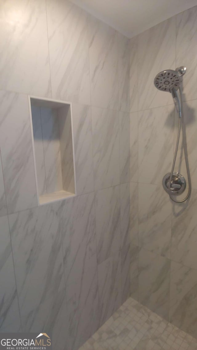 interior space featuring a tile shower