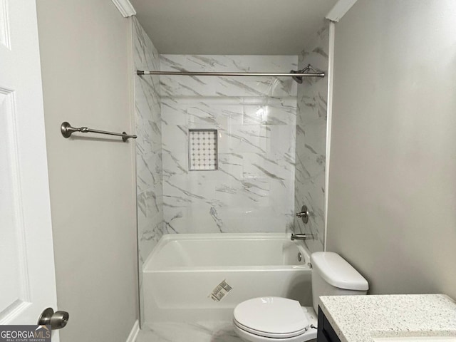 full bathroom with vanity, tiled shower / bath combo, and toilet