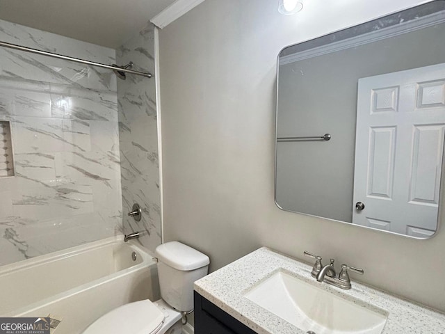 full bathroom featuring vanity, toilet, tiled shower / bath combo, and crown molding