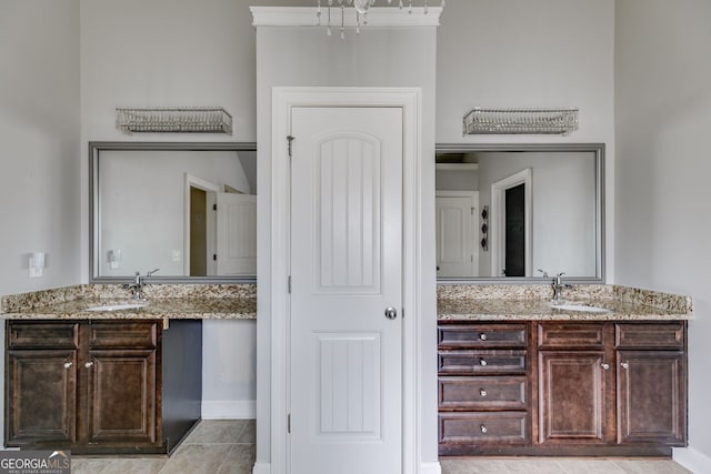 bathroom with vanity and tile patterned flooring