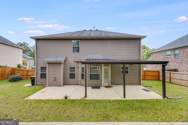 back of property featuring a patio area and a lawn