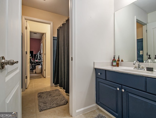 bathroom featuring tile patterned flooring and vanity