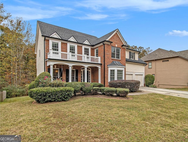 view of front of property with a front yard and a garage