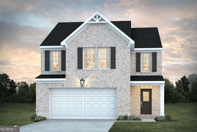 view of front facade with a garage and a lawn