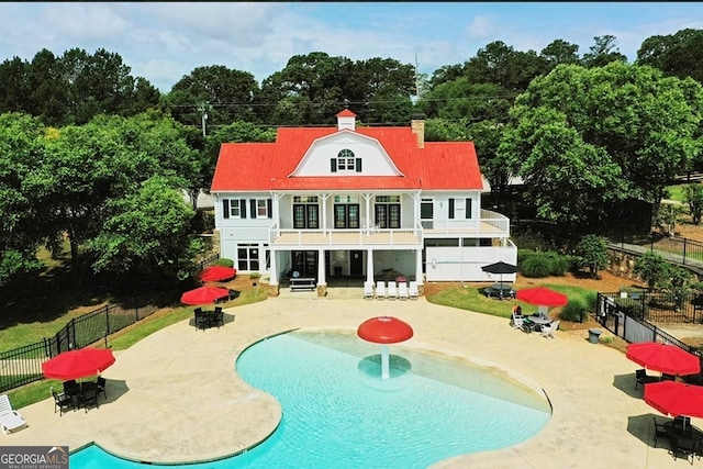 view of swimming pool with a patio