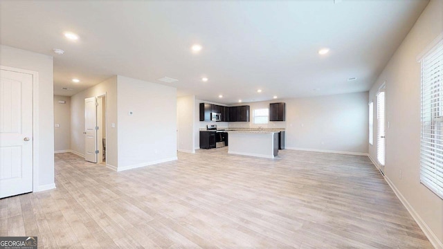 unfurnished living room with light hardwood / wood-style flooring