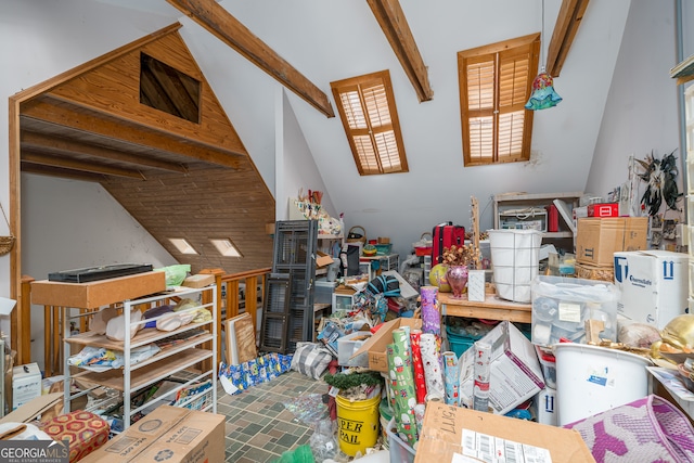 interior space featuring vaulted ceiling with beams